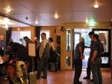 Friday morning, visitors at the registration desk.